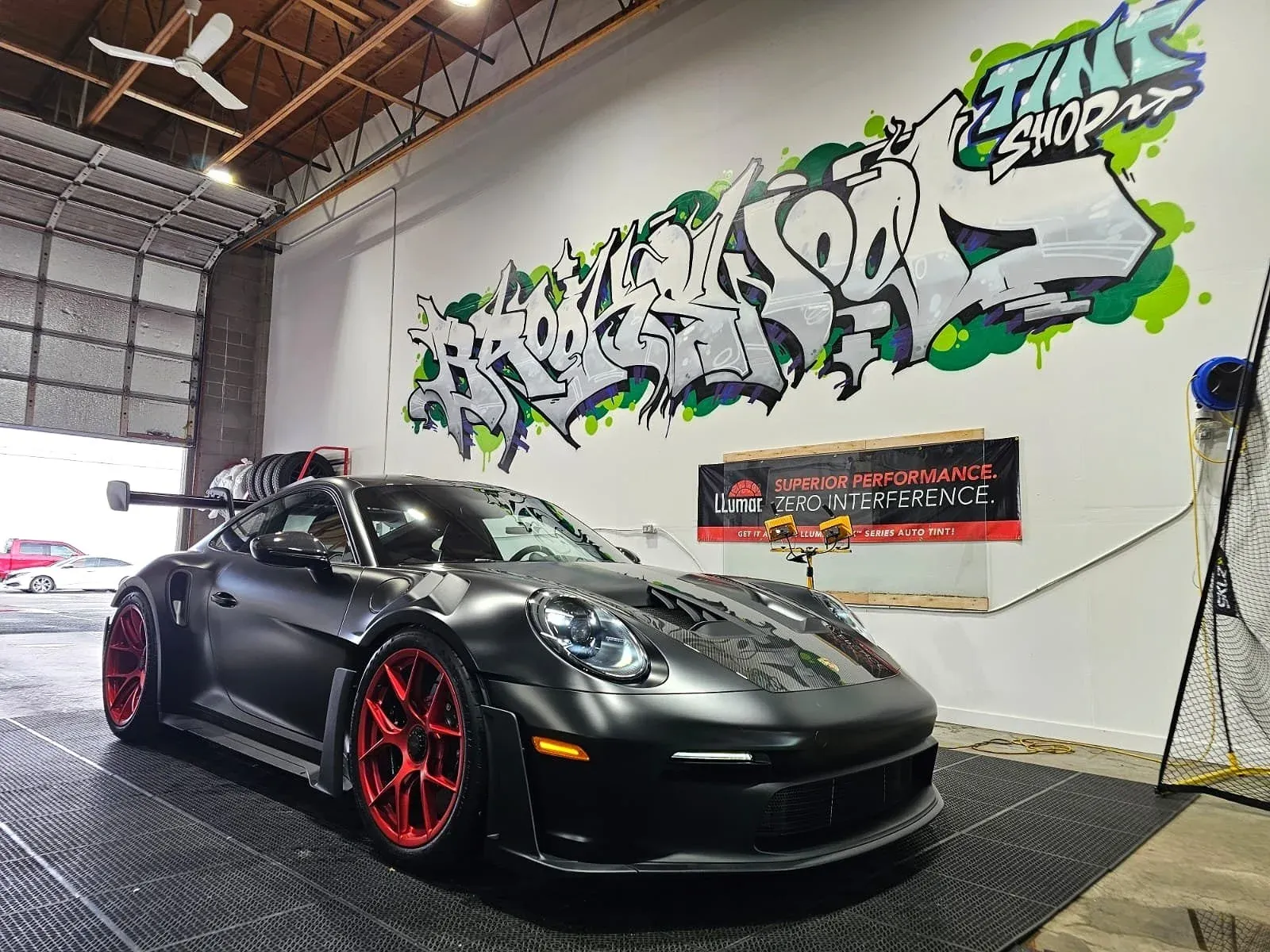 Matte black Porsche 911 GT3 RS inside Brookswood Tint Shop