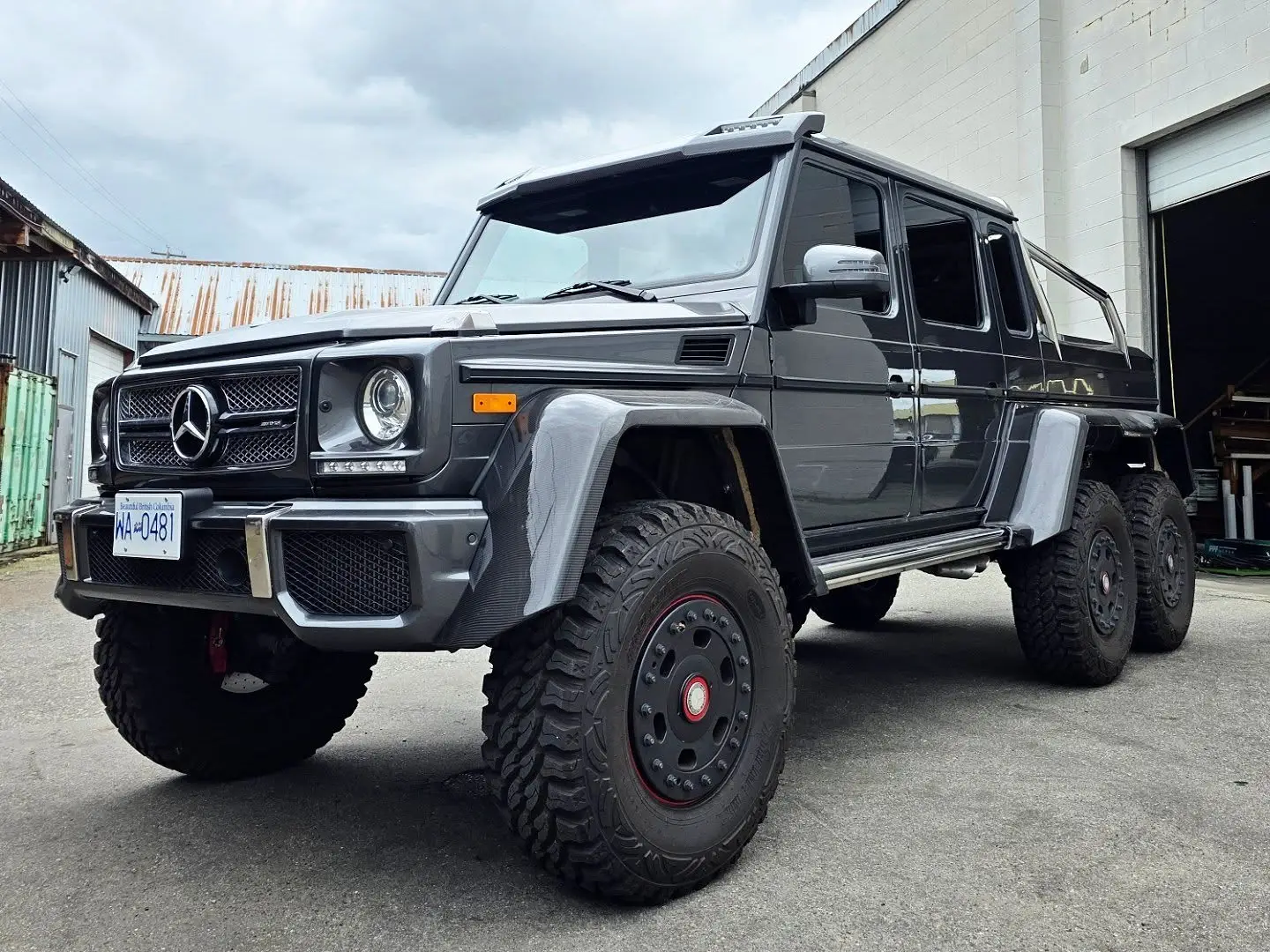 Mercedes G63 6x6 pickup outside the shop, windows tinted