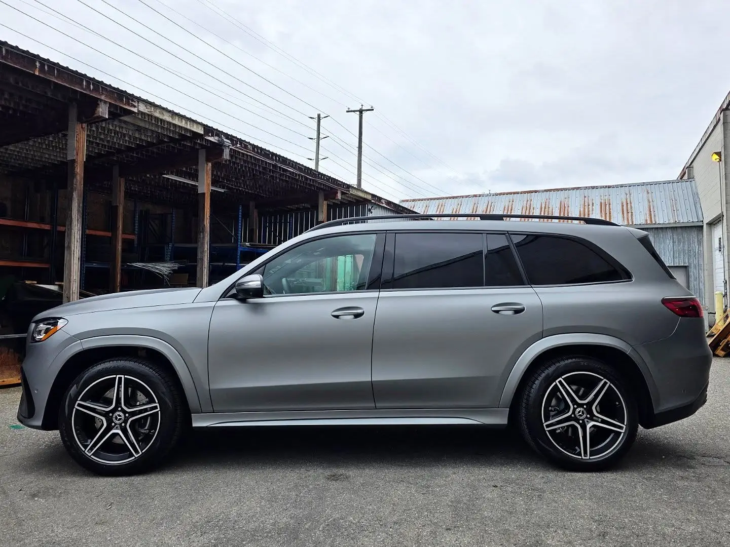 Side profile of a Mercedes GLS in matte gunmetal wrap