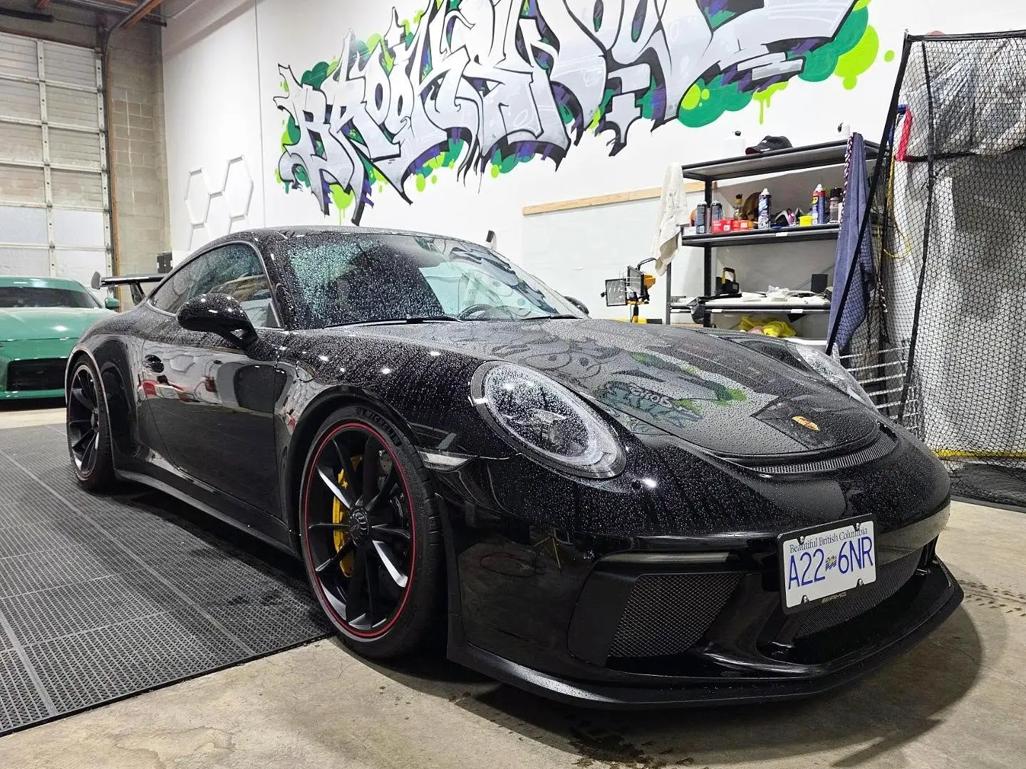 Black Porsche 911 GT3 inside the shop