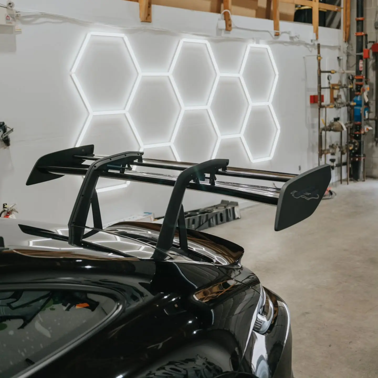 Porsche 911 GT3 RS wing under the hexagon lights