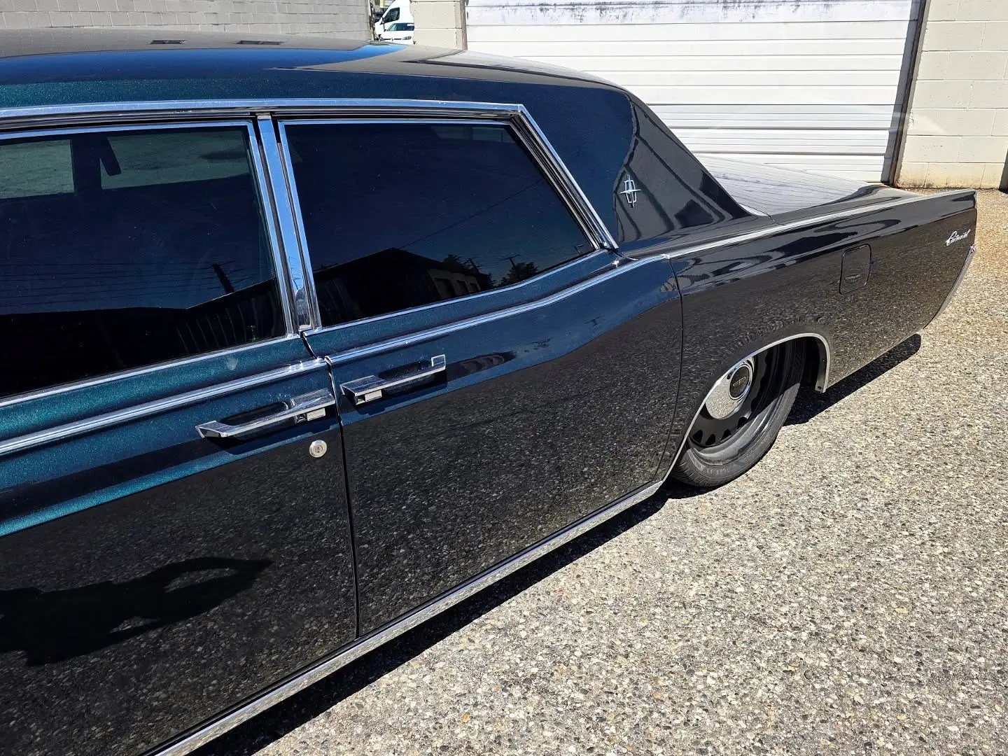 Close-up of the tinted rear door glass on a 1967 Lincoln Continental