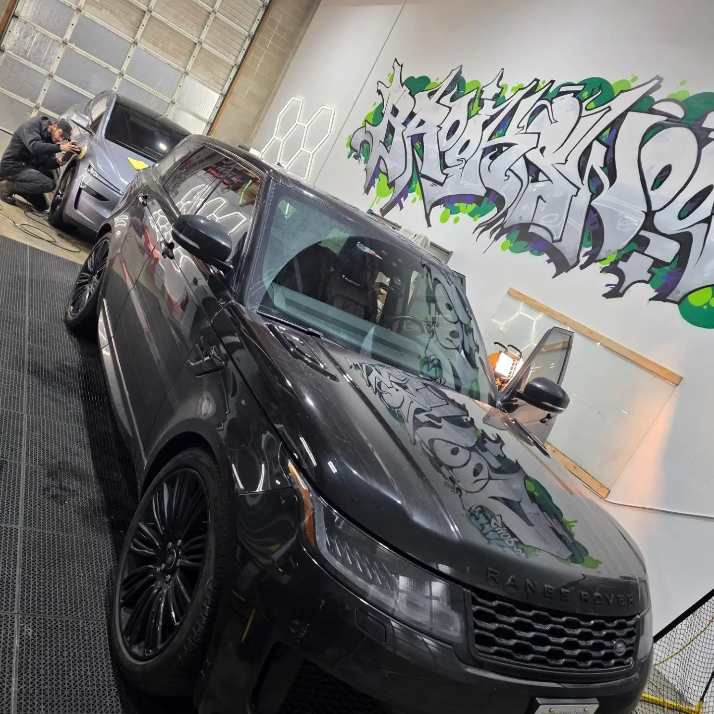 Black Range Rover inside the shop