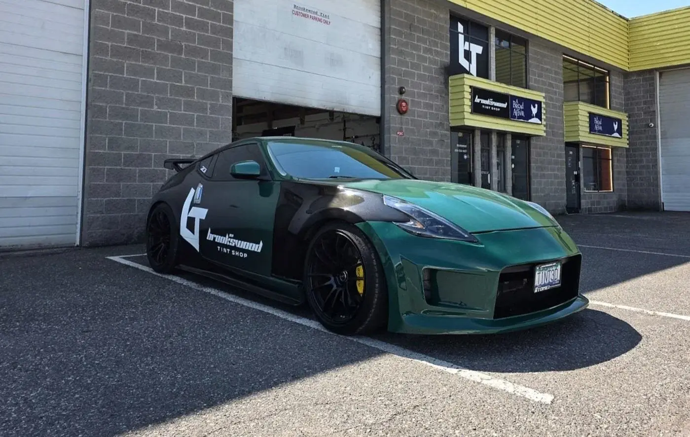 Wrapped shop car at the storefront