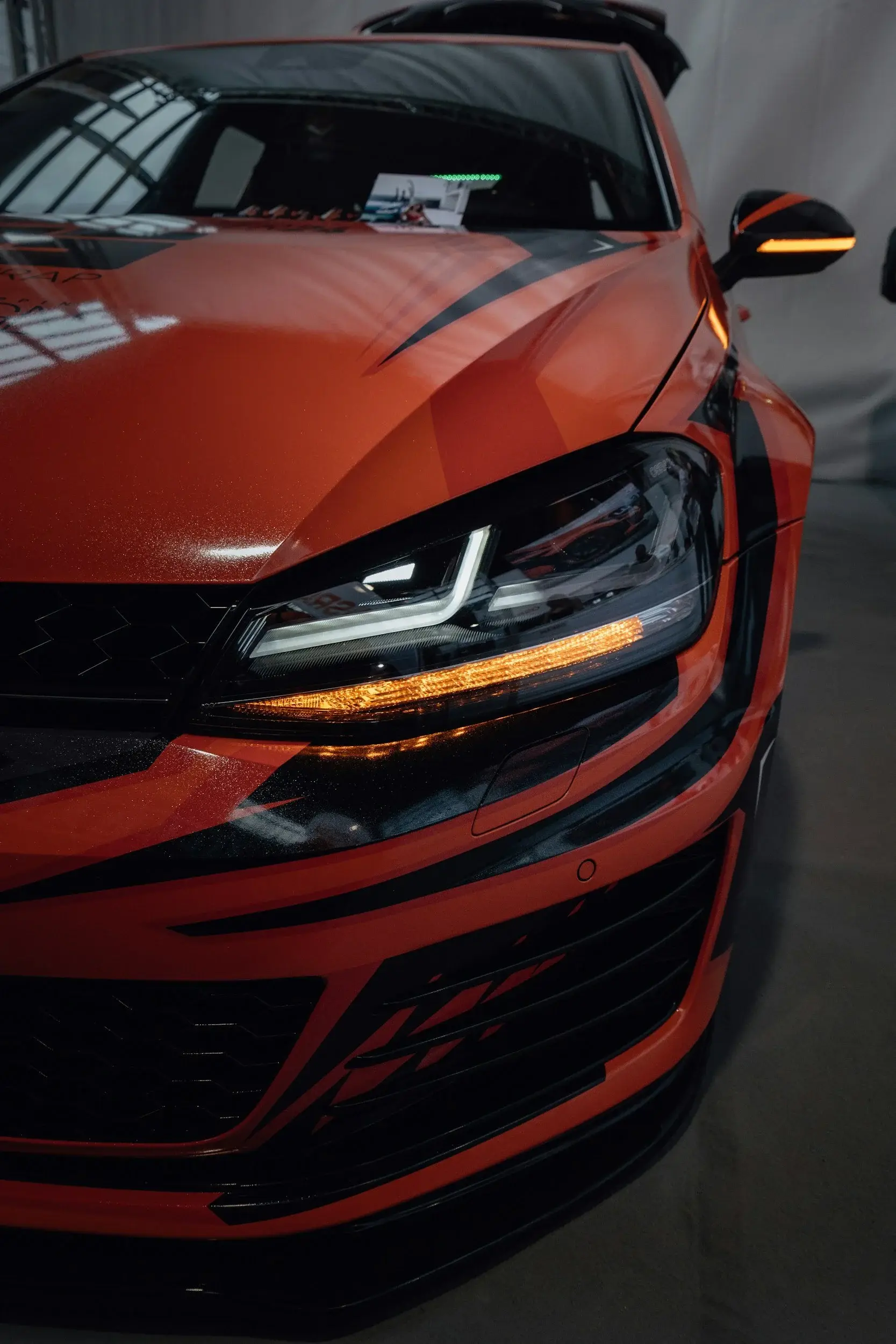 Sharp LED headlight on an orange car