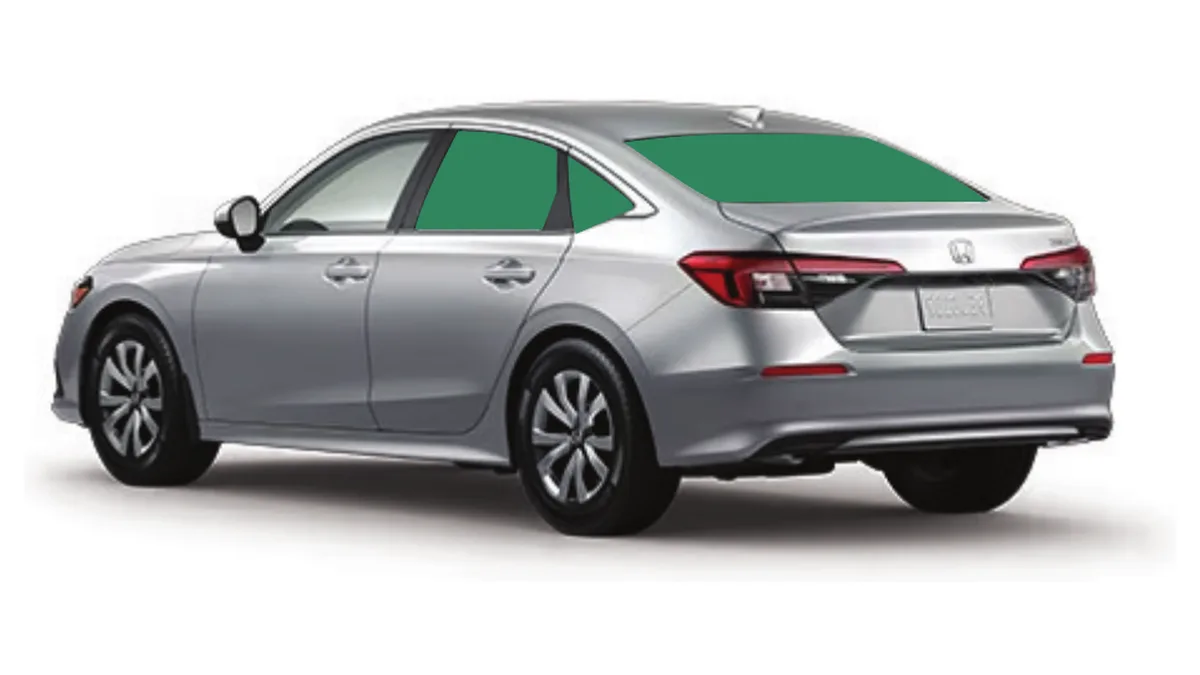 Silver sedan seen from behind with the rear door, quarter and back windows shaded to show the tinted glass