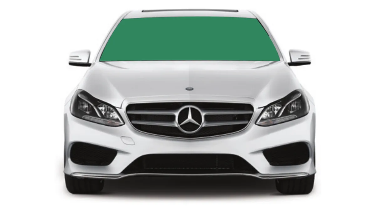 White Mercedes sedan seen head-on with the full windshield shaded to show the tinted glass